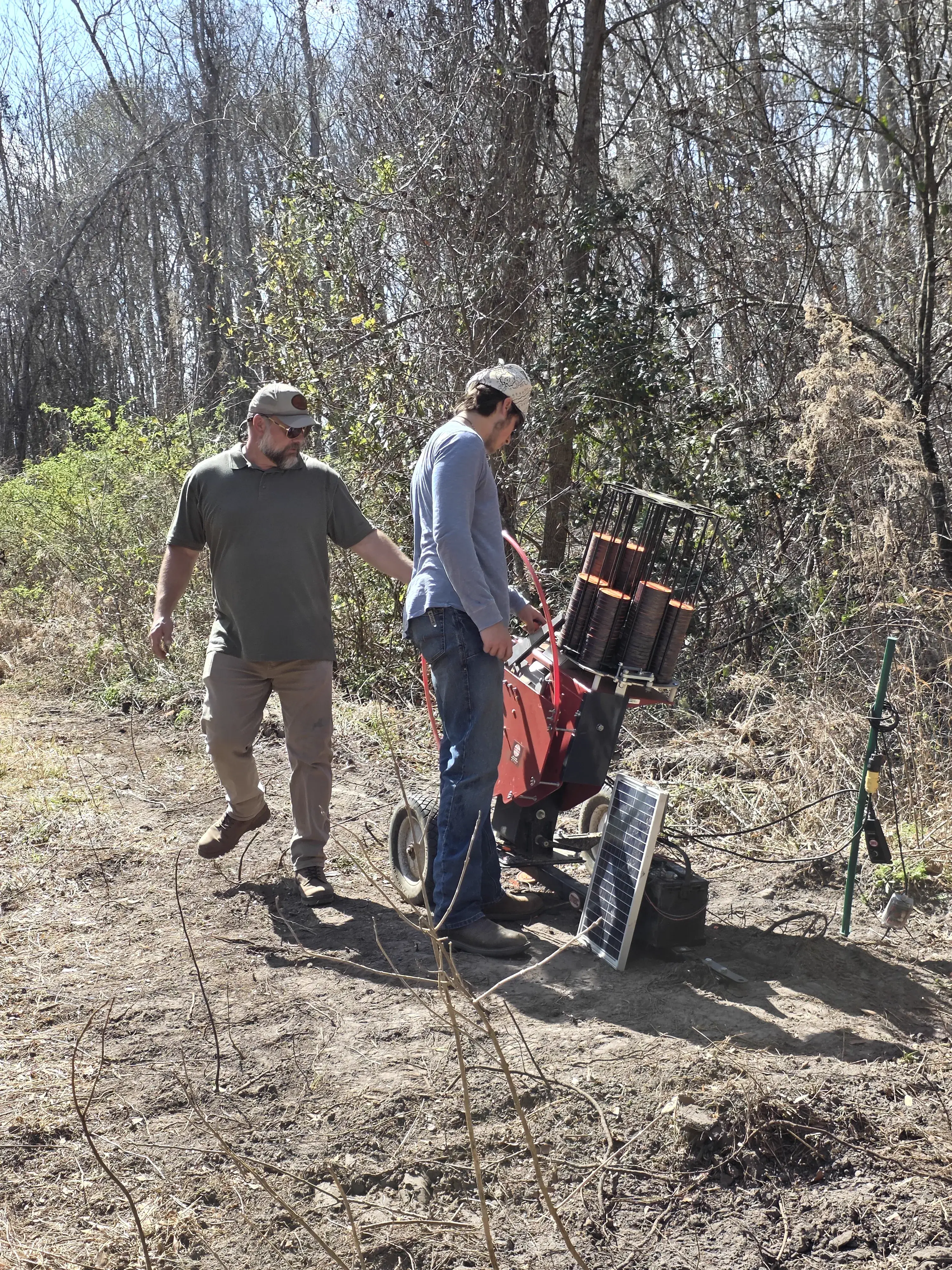 Volunteers setting up trap machines at Traditions Field Club